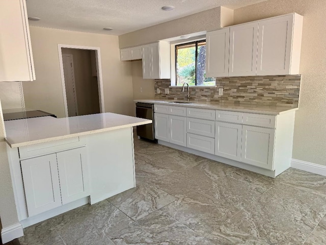 5711 Trail Lake Dr, Arlington, TX 76016 - kitchen with dishwashing machine, a sink, white cabinets, decorative backsplash, and light countertops