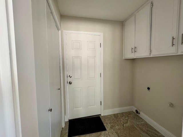 5711 Trail Lake Dr, Arlington, TX 76016 - laundry area with cabinet space, baseboards, electric dryer hookup, and marble finish floors
