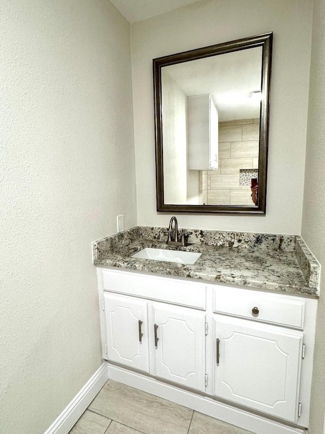 5711 Trail Lake Dr, Arlington, TX 76016 - bathroom featuring baseboards and vanity