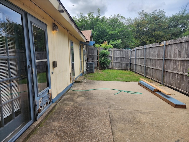 2612 Santa Barbara Dr, Grand Prairie, TX 75052 - view of patio with central air condition unit and a fenced backyard