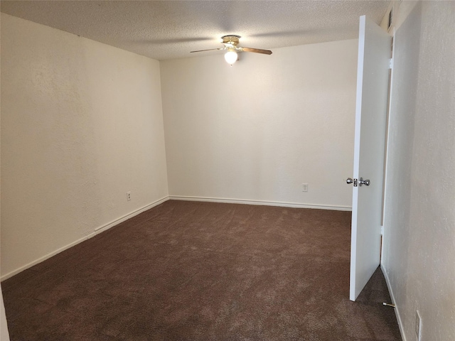 2612 Santa Barbara Dr, Grand Prairie, TX 75052 - empty room with dark colored carpet, ceiling fan, a textured ceiling, and baseboards