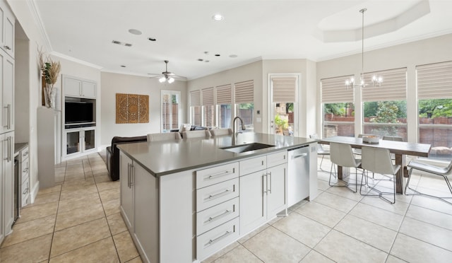 5063 Stillwater Trl, Frisco, TX 75034 - kitchen with a sink, dishwasher, ceiling fan, a center island with sink, and light tile patterned flooring