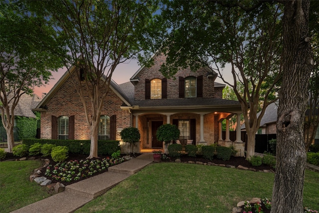 5063 Stillwater Trl, Frisco, TX 75034 - view of front of property with brick siding, a porch, and a lawn