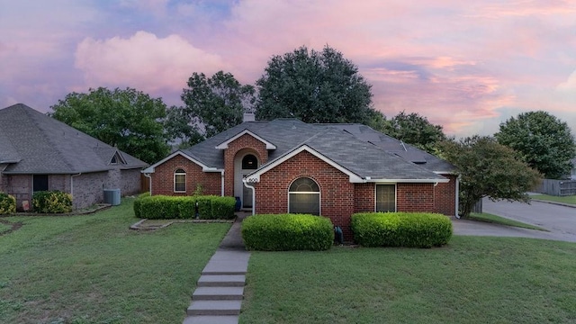 600 Hanover Dr, Waxahachie, TX 75165 - view of front of home featuring brick siding, a front yard, and a chimney