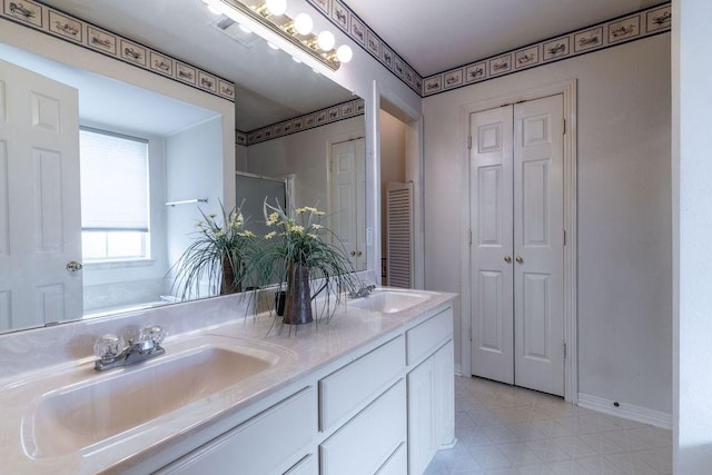 600 Hanover Dr, Waxahachie, TX 75165 - full bath with a closet, double vanity, and tile patterned floors