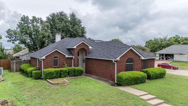 600 Hanover Dr, Waxahachie, TX 75165 - ranch-style home featuring brick siding, a chimney, and a shingled roof