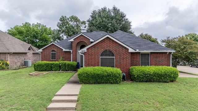600 Hanover Dr, Waxahachie, TX 75165 - ranch-style home featuring brick siding, a front yard, and a chimney