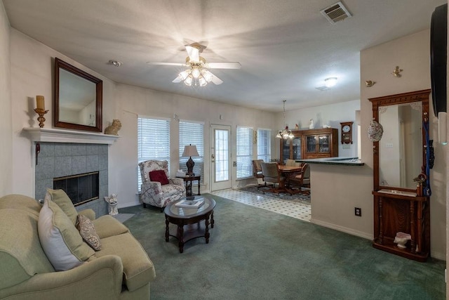 600 Hanover Dr, Waxahachie, TX 75165 - carpeted living area featuring ceiling fan and a tile fireplace