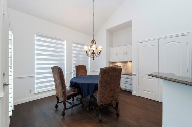 7100 Oakbrook Dr, Plano, TX 75025 - dining space featuring vaulted ceiling, dark wood-style flooring, a chandelier, and baseboards