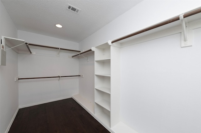 7100 Oakbrook Dr, Plano, TX 75025 - spacious closet featuring dark wood finished floors