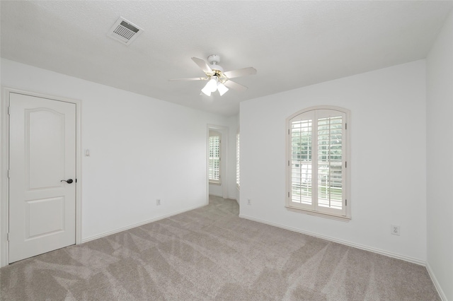 7100 Oakbrook Dr, Plano, TX 75025 - carpeted spare room with ceiling fan and baseboards