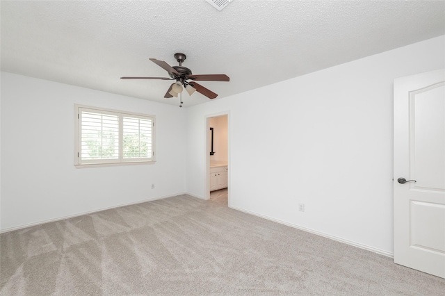 7100 Oakbrook Dr, Plano, TX 75025 - empty room featuring light carpet, a ceiling fan, and baseboards