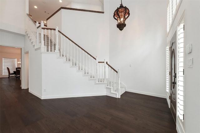 7100 Oakbrook Dr, Plano, TX 75025 - entryway with a towering ceiling, stairway, wood finished floors, baseboards, and recessed lighting