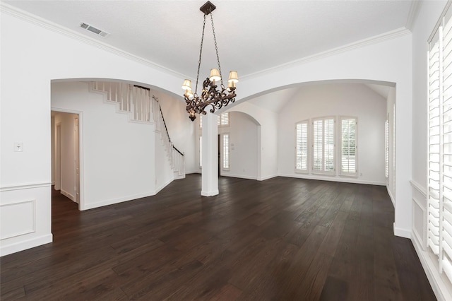 7100 Oakbrook Dr, Plano, TX 75025 - unfurnished dining area with dark wood-style floors, stairs, ornamental molding, a chandelier, and arched walkways