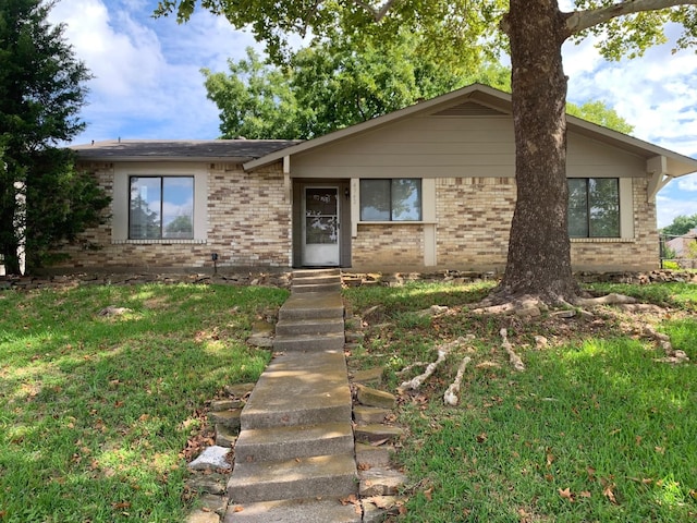 4742 Cliffwood Dr, Garland, TX 75043 - view of front of house featuring brick siding and a front lawn