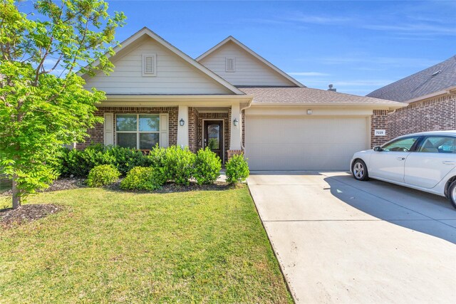 7225 Tesoro Trl, Fort Worth, TX 76131 - view of front facade featuring brick siding, an attached garage, and a front yard