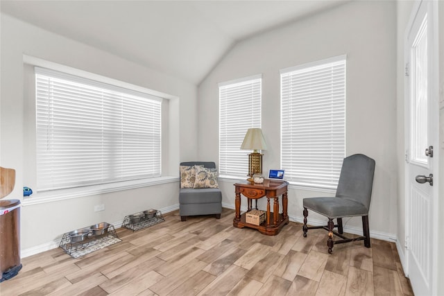 7225 Tesoro Trl, Fort Worth, TX 76131 - living area featuring light wood-type flooring, lofted ceiling, and baseboards