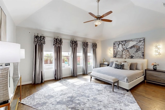 16175 Barton Creek Ln, Frisco, TX 75033 - bedroom with lofted ceiling, wood finished floors, ceiling fan, and baseboards