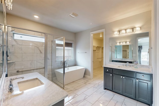 16175 Barton Creek Ln, Frisco, TX 75033 - bathroom featuring a shower stall, plenty of natural light, a freestanding bath, and vanity