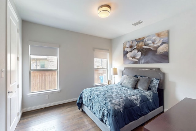 16175 Barton Creek Ln, Frisco, TX 75033 - bedroom with wood finished floors and baseboards
