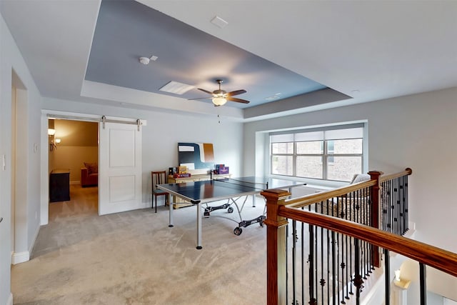 16175 Barton Creek Ln, Frisco, TX 75033 - office featuring a raised ceiling, a barn door, light carpet, and ceiling fan