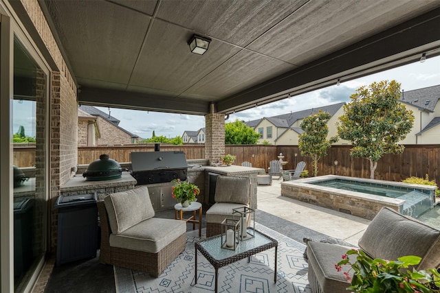 16175 Barton Creek Ln, Frisco, TX 75033 - view of patio featuring an outdoor kitchen, grilling area, and a fenced backyard