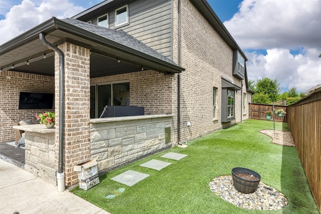 16175 Barton Creek Ln, Frisco, TX 75033 - view of side of property with brick siding and a shingled roof