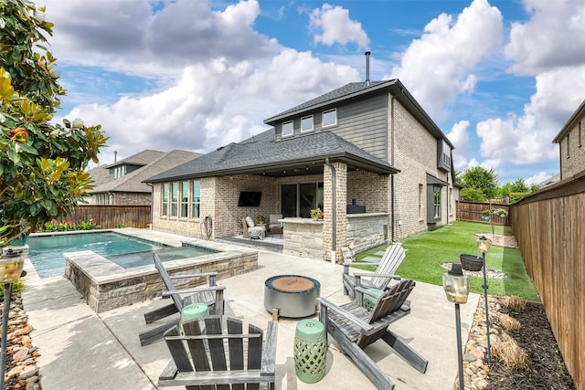 16175 Barton Creek Ln, Frisco, TX 75033 - back of property with brick siding, a patio area, and a shingled roof