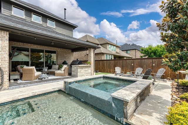 16175 Barton Creek Ln, Frisco, TX 75033 - view of swimming pool with area for grilling, a patio, outdoor lounge area, and fence
