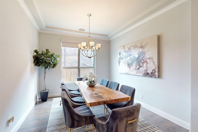 16175 Barton Creek Ln, Frisco, TX 75033 - dining space with a chandelier, baseboards, dark wood finished floors, crown molding, and a raised ceiling