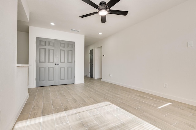22 W Mountain Ln Unit 42, Grand Prairie, TX 75052 - unfurnished bedroom featuring light wood finished floors, recessed lighting, baseboards, a closet, and a ceiling fan