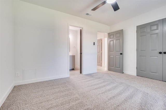 22 W Mountain Ln Unit 42, Grand Prairie, TX 75052 - unfurnished bedroom with light carpet, baseboards, ensuite bath, and a ceiling fan