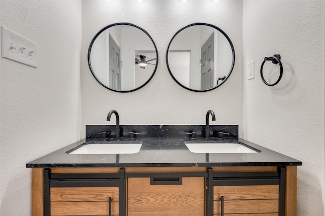 22 W Mountain Ln Unit 42, Grand Prairie, TX 75052 - bathroom featuring double vanity and a textured wall