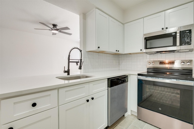 22 W Mountain Ln Unit 42, Grand Prairie, TX 75052 - kitchen with stainless steel appliances, a sink, light countertops, tasteful backsplash, and ceiling fan