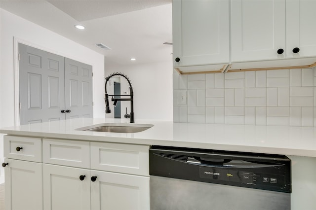 22 W Mountain Ln Unit 42, Grand Prairie, TX 75052 - kitchen featuring stainless steel dishwasher, a sink, decorative backsplash, white cabinetry, and recessed lighting