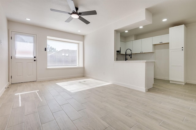 22 W Mountain Ln Unit 42, Grand Prairie, TX 75052 - unfurnished living room with light wood-style floors, ceiling fan, baseboards, and recessed lighting
