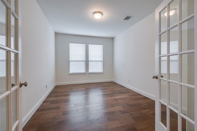 15429 Pioneer Bluff Trl, Fort Worth, TX 76262 - spare room with french doors, dark wood-type flooring, and baseboards