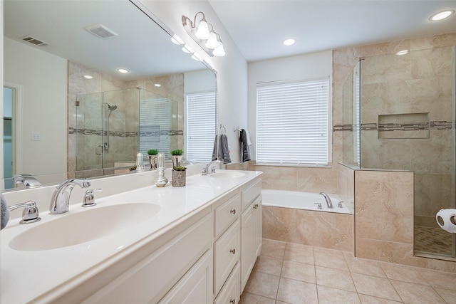 15429 Pioneer Bluff Trl, Fort Worth, TX 76262 - bathroom with a shower stall, a bath, tile patterned floors, double vanity, and recessed lighting