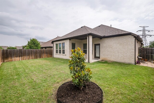 15429 Pioneer Bluff Trl, Fort Worth, TX 76262 - rear view of property featuring a shingled roof and brick siding