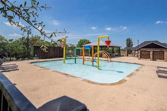 15429 Pioneer Bluff Trl, Fort Worth, TX 76262 - community pool featuring a water play area, fence, a playground, and a patio area