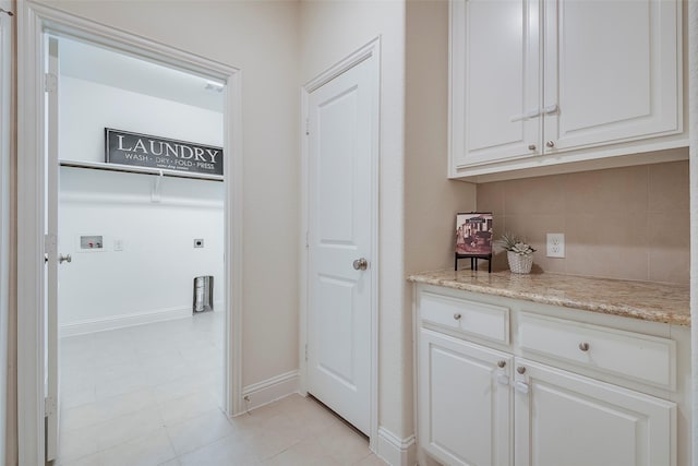 15429 Pioneer Bluff Trl, Fort Worth, TX 76262 - bar area with tasteful backsplash, baseboards, and light tile patterned flooring