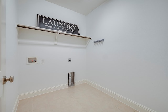 15429 Pioneer Bluff Trl, Fort Worth, TX 76262 - laundry room with hookup for a washing machine, hookup for an electric dryer, baseboards, and light tile patterned flooring