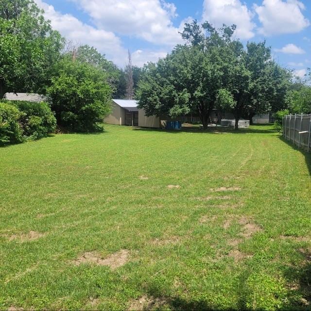 1101 Dell St, White Settlement, TX 76108 - view of yard with an outdoor structure and a pole building