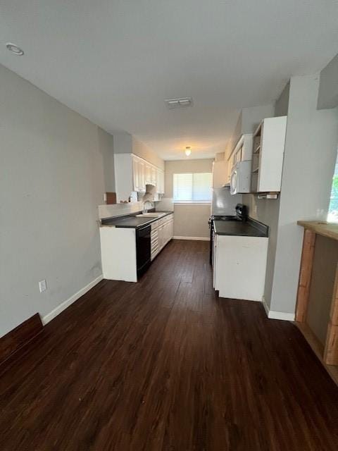 kitchen featuring black dishwasher, dark wood finished floors, white cabinets, open shelves, and baseboards