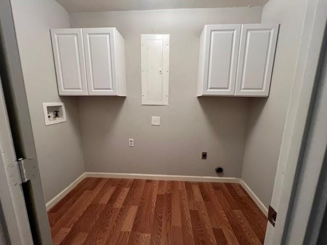 laundry room featuring washer hookup, cabinet space, electric dryer hookup, wood finished floors, and baseboards