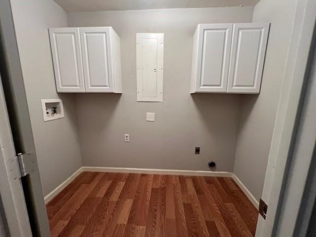1101 Dell St, White Settlement, TX 76108 - laundry area with hookup for a washing machine, cabinet space, electric dryer hookup, wood finished floors, and baseboards
