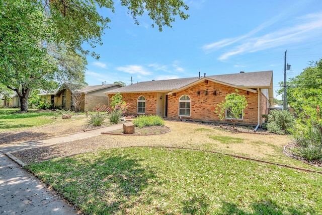 932 Goodwin Dr, Plano, TX 75023 - ranch-style home featuring brick siding, a front lawn, and a shingled roof