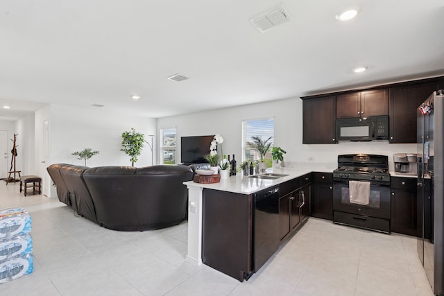 301 Dry Canyon Way, Fort Worth, TX 76052 - kitchen featuring black appliances, open floor plan, a sink, light countertops, and recessed lighting