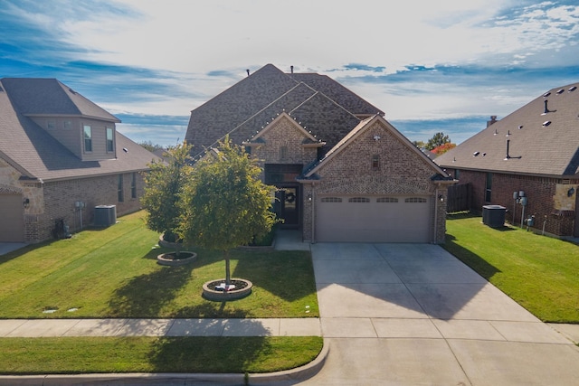 725 Seabourne Dr, Saginaw, TX 76179 - view of front of home with brick siding, driveway, central AC unit, and a front lawn