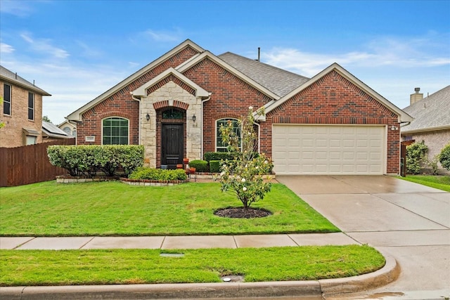view of front facade with brick siding, a garage, driveway, and stone siding